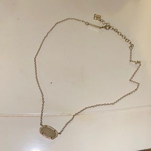 Kendra Scott gold necklace, white iridescent stone